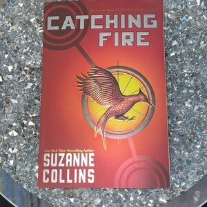 The second book of the hunger games catching fire by Suzanne Collins June 2013